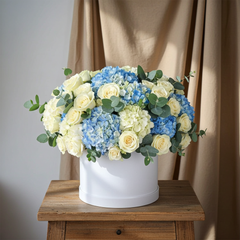 Elegant Blue and White Hydrangea and Rose Arrangement