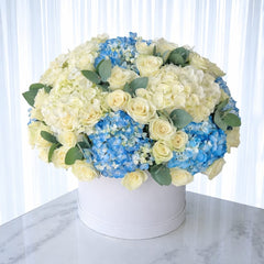 Elegant Blue and White Hydrangea and Rose Arrangement