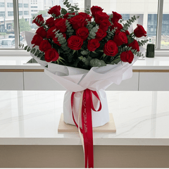 Elegant Red Roses Floral Arrangement with Ribbon - Rawadat Al Ward