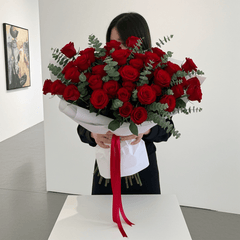 Elegant Red Roses Floral Arrangement with Ribbon - Rawadat Al Ward