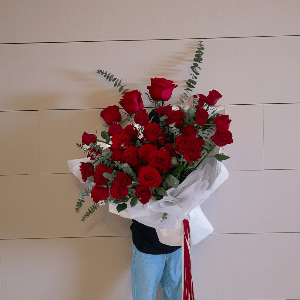 Elegant Red Roses Floral Arrangement with Ribbon - Rawadat Al Ward