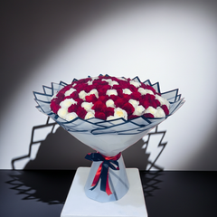 Romantic Red and White Roses in Stylish Packaging