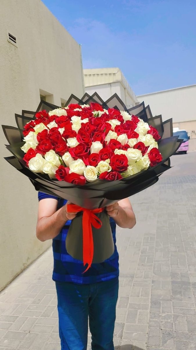 Romantic Red and White Roses in Stylish Packaging - Rawadat Al Ward