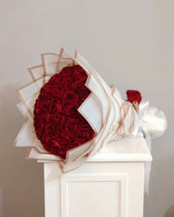 Classic Red Roses Wrapped in White Paper - Rawadat Al Ward