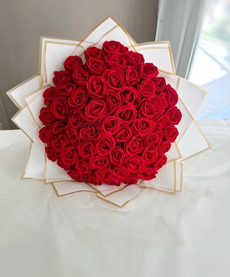 Classic Red Roses Wrapped in White Paper - Rawadat Al Ward