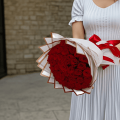 Classic Red Roses Wrapped in White Paper - Rawadat Al Ward