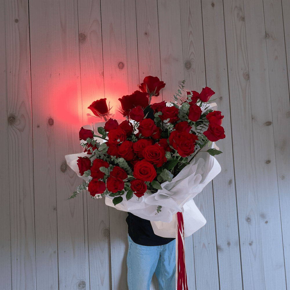 Elegant Red Roses Floral Arrangement with Ribbon - Rawadat Al Ward