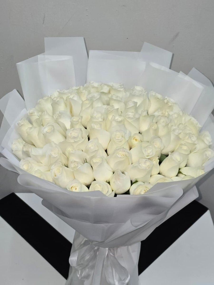 Luxury White Roses Wrapped in Paper - Rawadat Al Ward