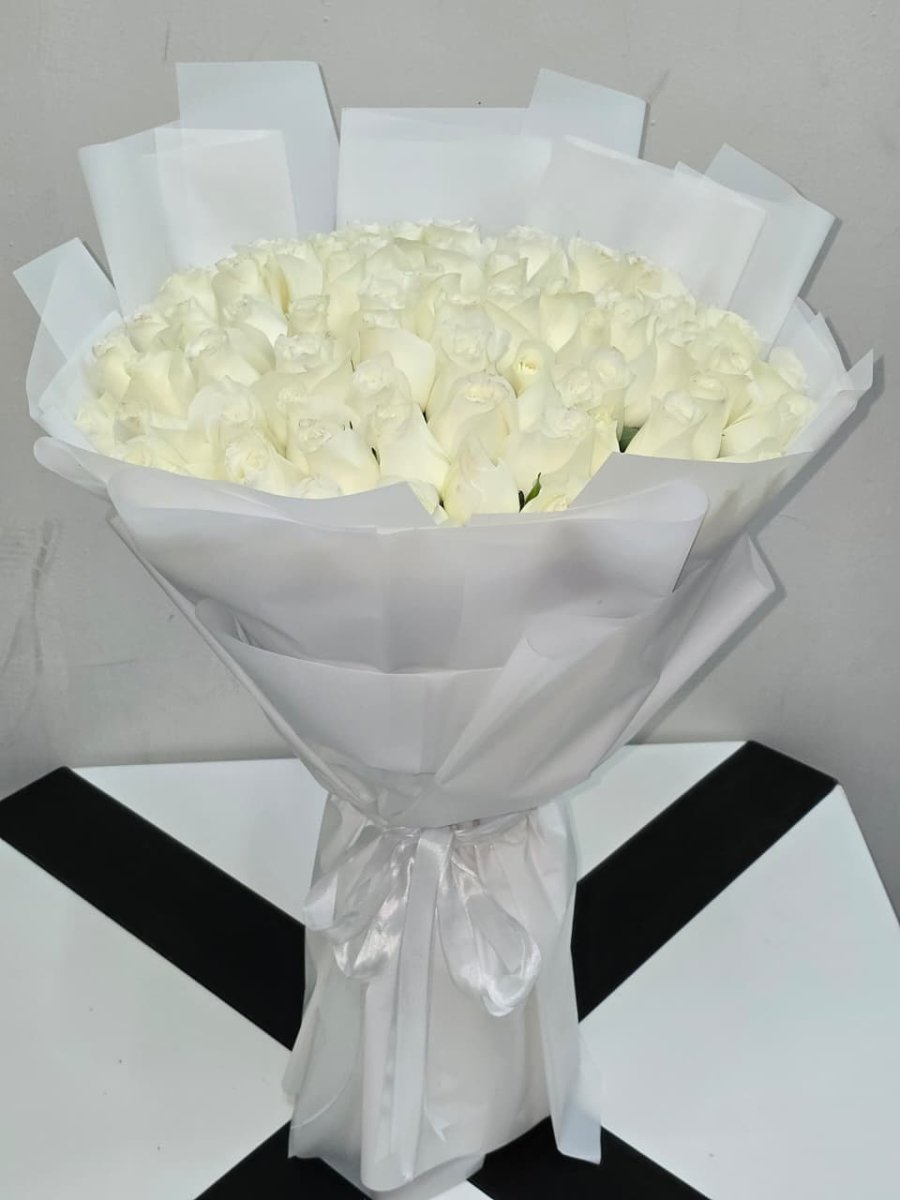 Luxury White Roses Wrapped in Paper - Rawadat Al Ward