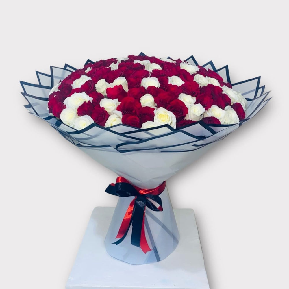 Romantic Red and White Roses in Stylish Packaging - Rawadat Al Ward