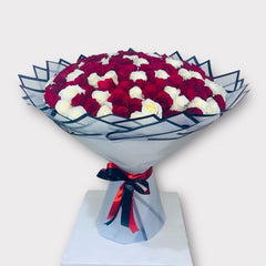 Romantic Red and White Roses in Stylish Packaging - Rawadat Al Ward